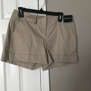 Creamy colored with a gold shimmer shorts